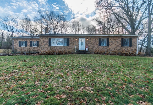 single story home featuring a front lawn