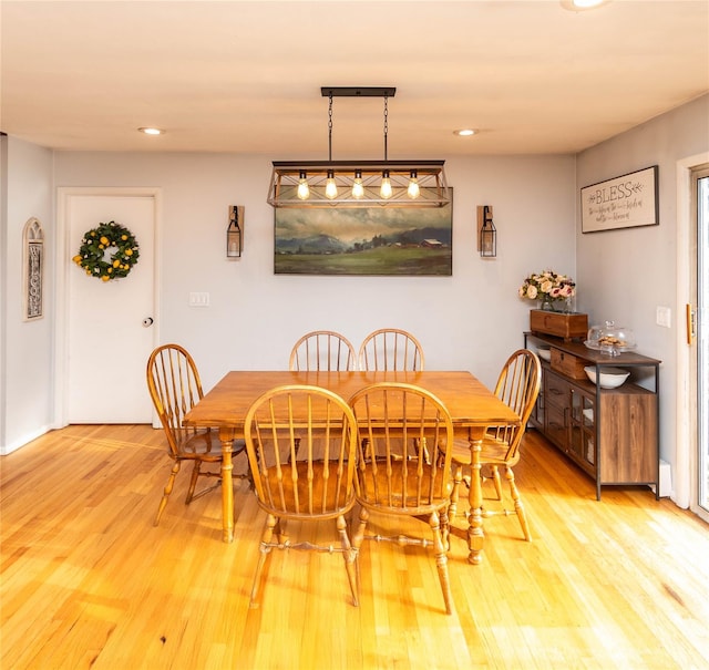 dining area with light hardwood / wood-style floors