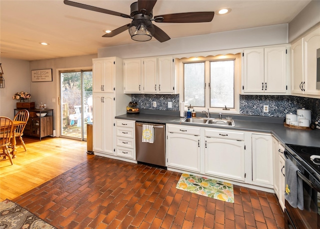 kitchen with sink, white cabinets, and dishwasher