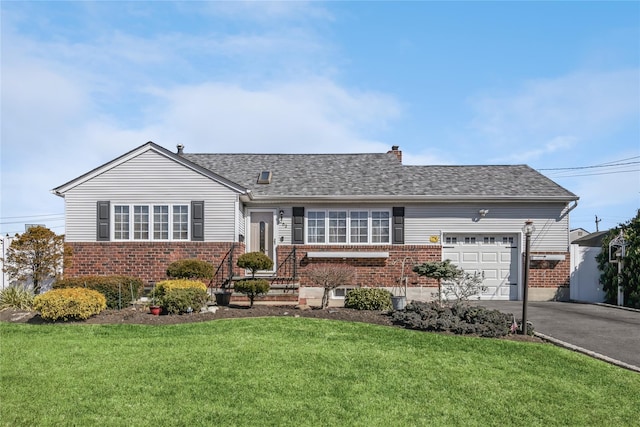 ranch-style home featuring aphalt driveway, brick siding, a garage, and a front yard