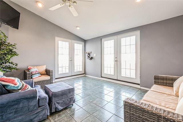 living area with a ceiling fan, french doors, baseboards, tile patterned flooring, and lofted ceiling