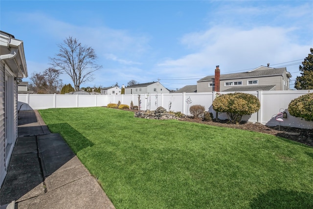 view of yard featuring a fenced backyard