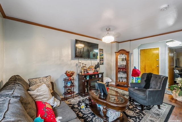 living room featuring wood-type flooring and ornamental molding