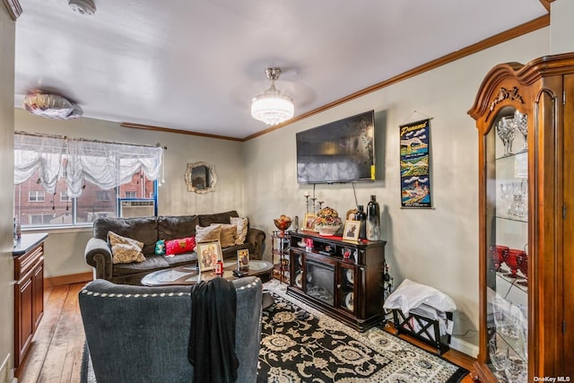 living room featuring ornamental molding and light hardwood / wood-style floors
