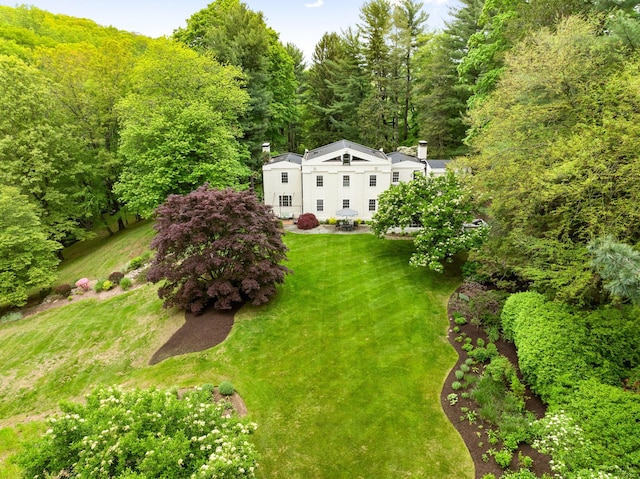view from above of property with a forest