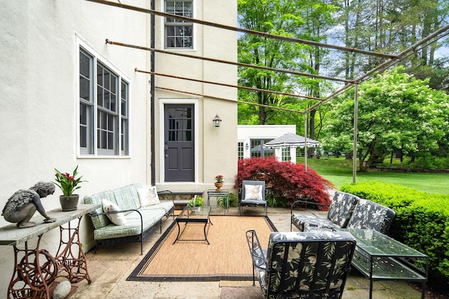 view of patio / terrace with outdoor lounge area and a pergola