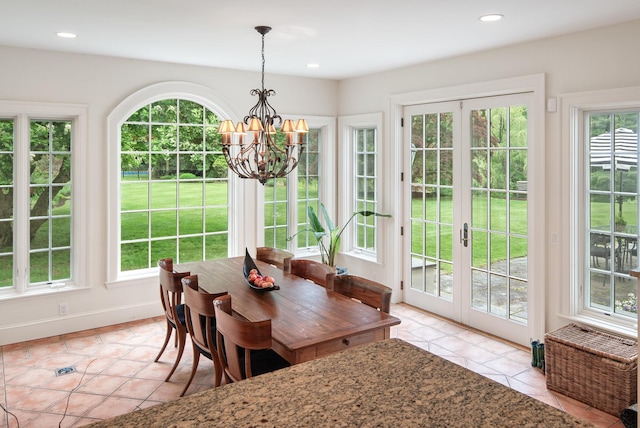 dining room with light tile patterned floors, a chandelier, recessed lighting, french doors, and baseboards