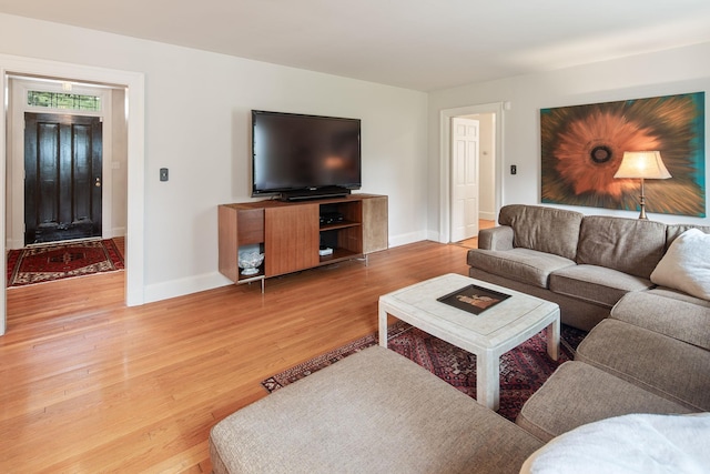 living area featuring wood finished floors and baseboards