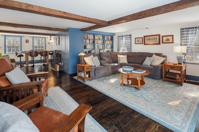 living room featuring dark hardwood / wood-style floors and beam ceiling