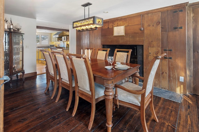 dining space with dark hardwood / wood-style floors