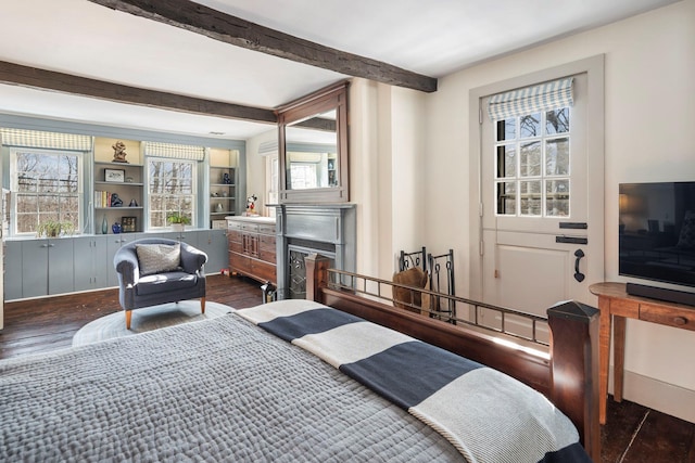 bedroom with dark wood-type flooring and beam ceiling