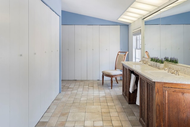 interior space featuring vaulted ceiling and sink