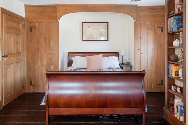 bedroom featuring dark hardwood / wood-style flooring