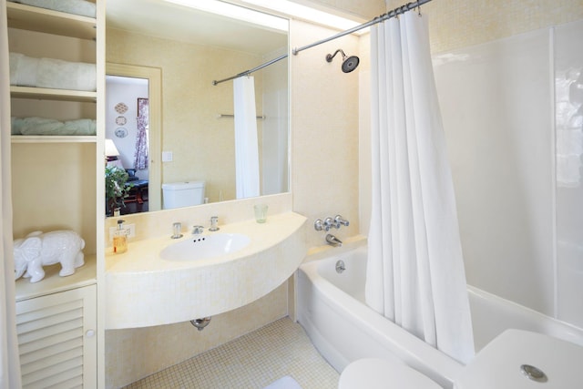 full bathroom featuring shower / tub combo, sink, tile patterned floors, and toilet