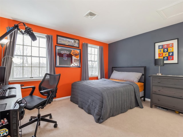 carpeted bedroom featuring multiple windows