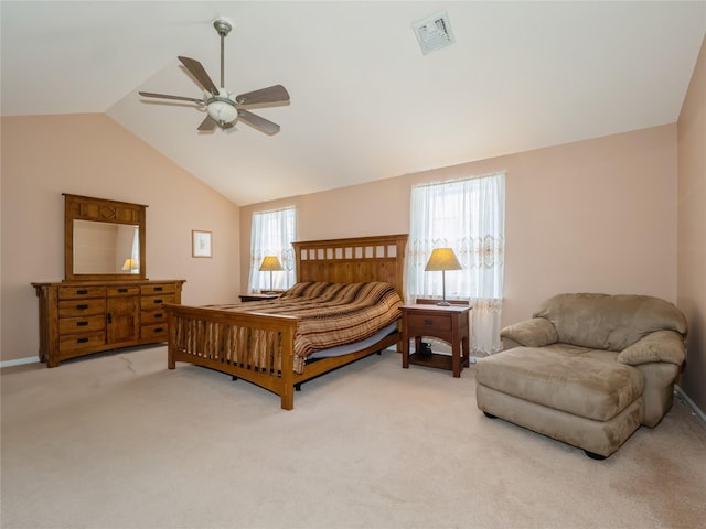 bedroom featuring light carpet, lofted ceiling, and ceiling fan