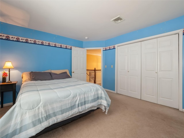 carpeted bedroom featuring a closet