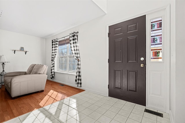 entrance foyer with light tile patterned floors