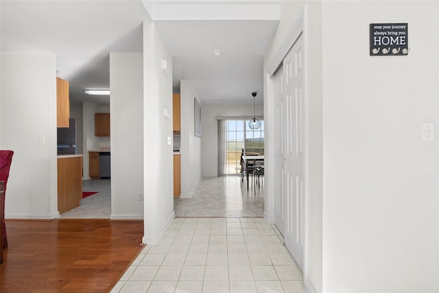 hall with light hardwood / wood-style flooring