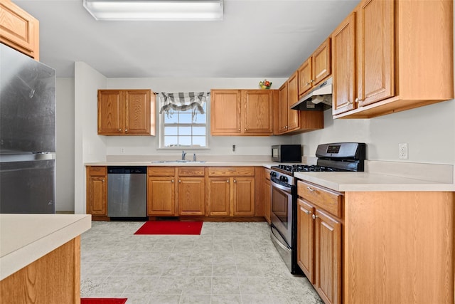 kitchen featuring appliances with stainless steel finishes and sink