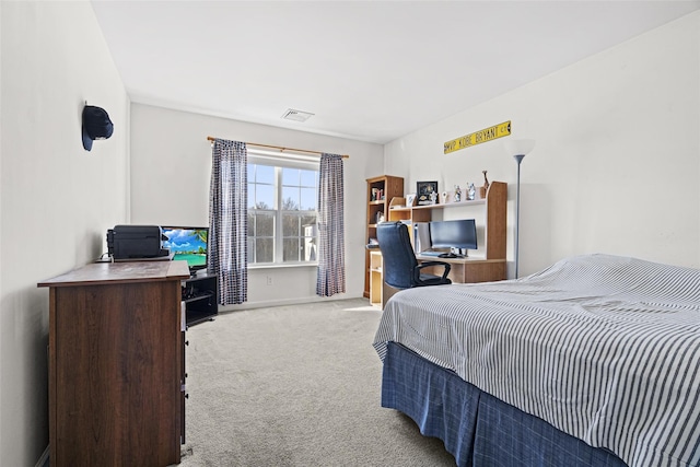 bedroom with light colored carpet