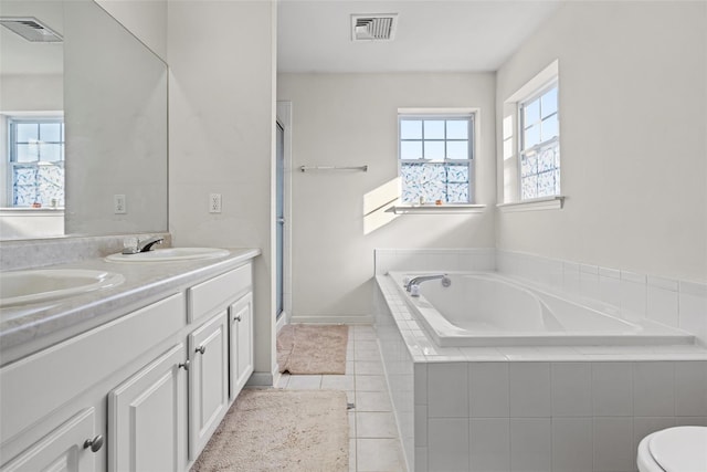 full bathroom featuring vanity, tile patterned floors, plus walk in shower, and toilet