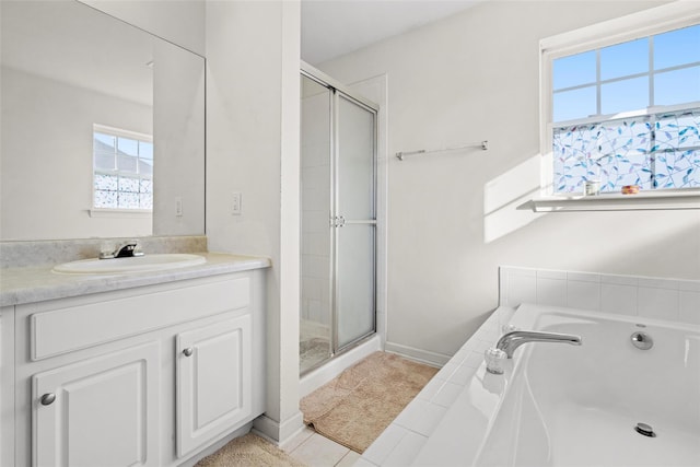 bathroom with vanity, separate shower and tub, and tile patterned floors