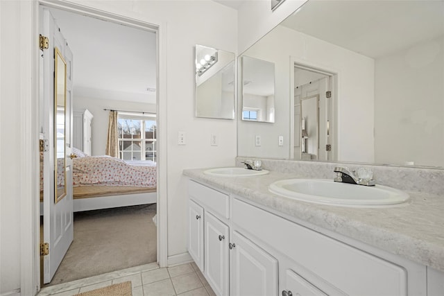 bathroom with tile patterned flooring and vanity