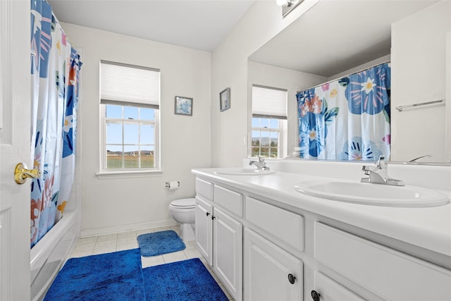 full bathroom with vanity, toilet, tile patterned flooring, and shower / bath combo with shower curtain