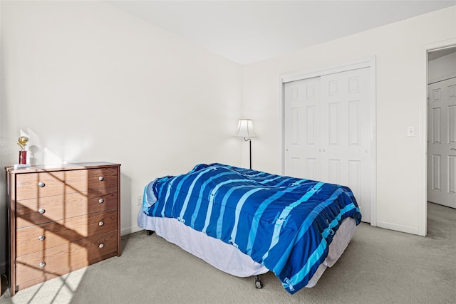 carpeted bedroom with a closet