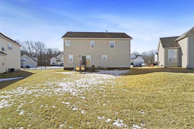 back of house with a yard and central AC unit