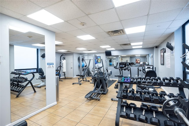 workout area with a paneled ceiling