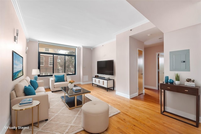 living room featuring crown molding, electric panel, and light wood-type flooring