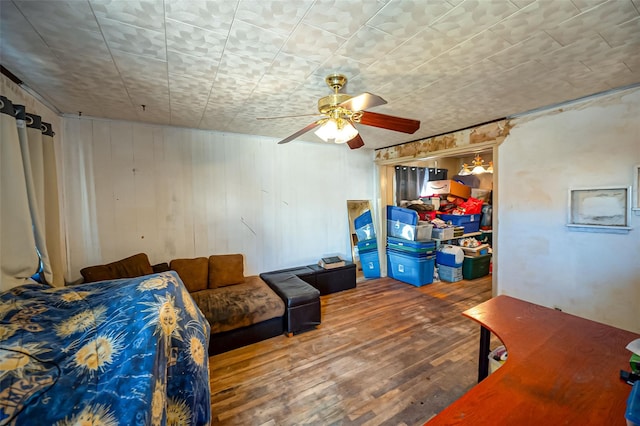 bedroom featuring ceiling fan and hardwood / wood-style flooring