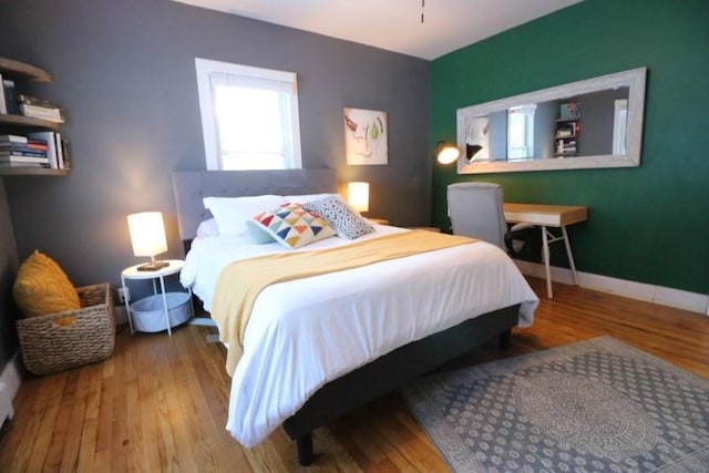 bedroom with light hardwood / wood-style flooring