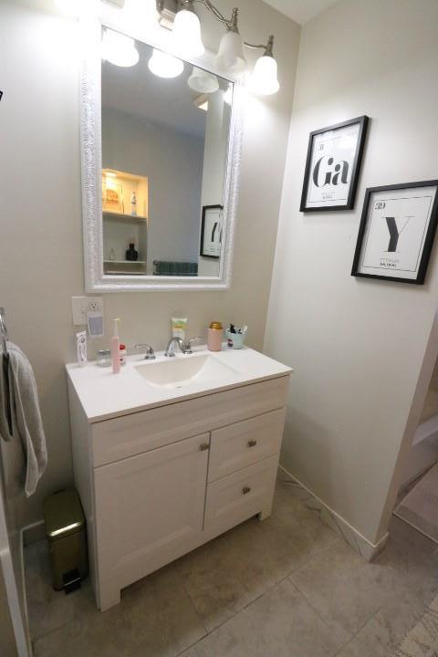 bathroom featuring vanity and tile patterned flooring