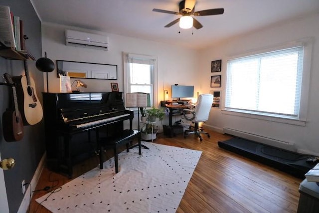 miscellaneous room featuring hardwood / wood-style flooring, baseboard heating, a wealth of natural light, and a wall unit AC