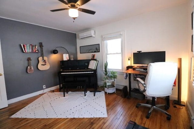 office space with hardwood / wood-style flooring, ceiling fan, and a wall mounted air conditioner