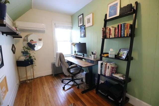 office space featuring a wall unit AC, radiator, dark hardwood / wood-style flooring, and vaulted ceiling