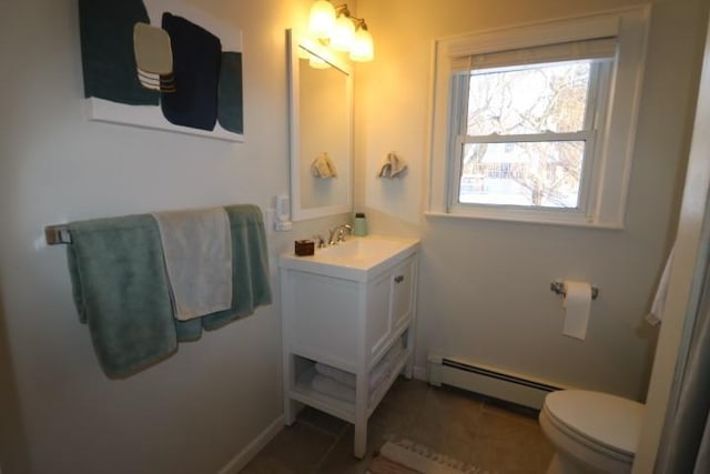 bathroom with a baseboard radiator, tile patterned floors, toilet, and vanity