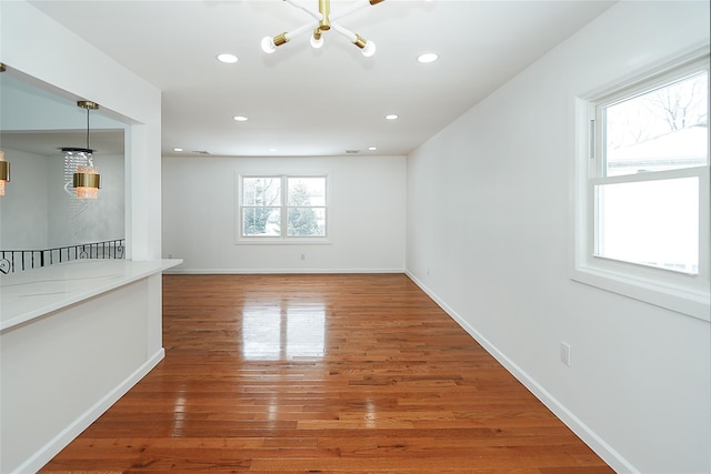 interior space with dark hardwood / wood-style floors and an inviting chandelier