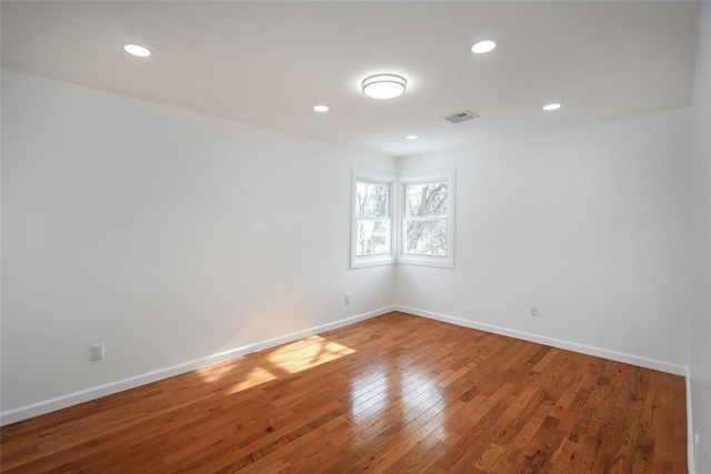 empty room featuring hardwood / wood-style flooring