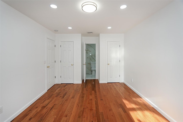 unfurnished room featuring hardwood / wood-style flooring