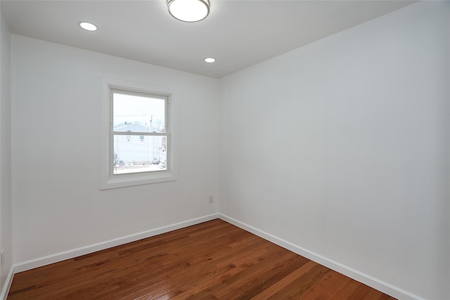 unfurnished room with hardwood / wood-style flooring