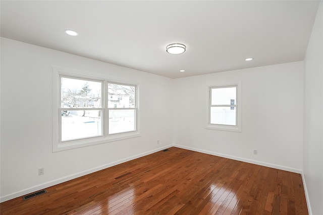 empty room with wood-type flooring