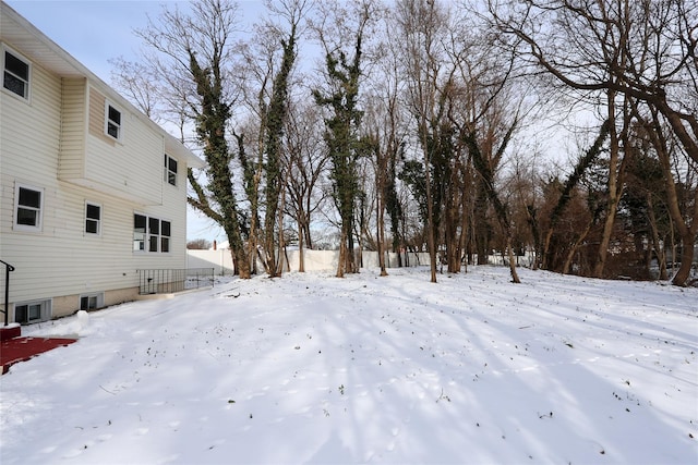 view of yard layered in snow