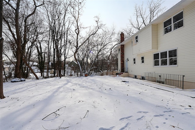 view of yard layered in snow