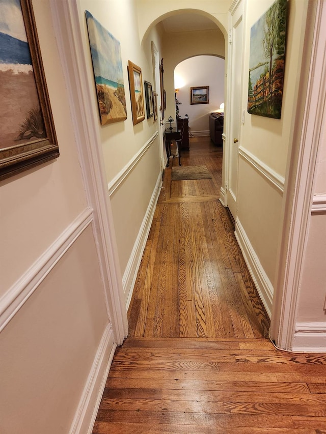 corridor featuring wood-type flooring