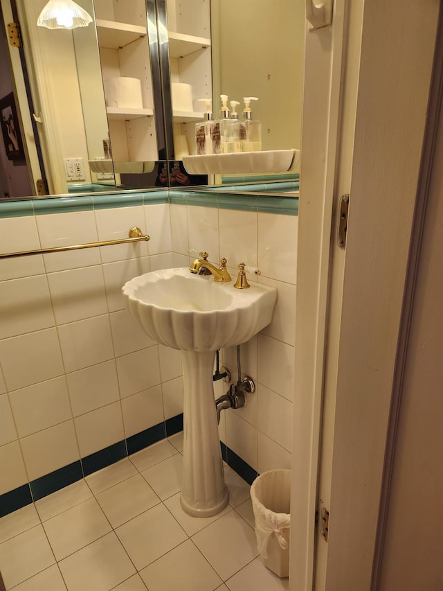 bathroom with tile walls and tile patterned floors