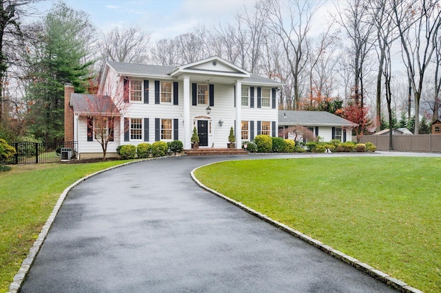 neoclassical / greek revival house with a front yard